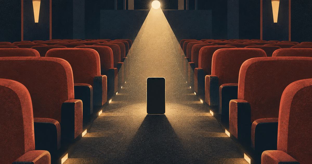 An empty cinema auditorium, a phone standing in the projector beam