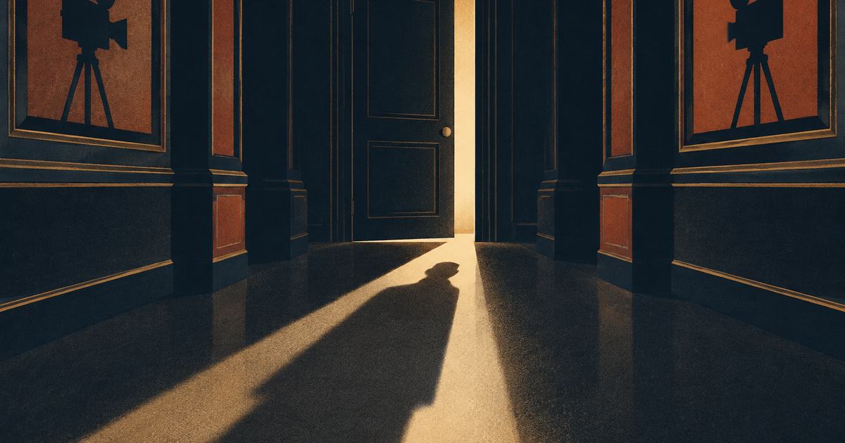A dark corridor with a door ajar and a strip of light on the floor